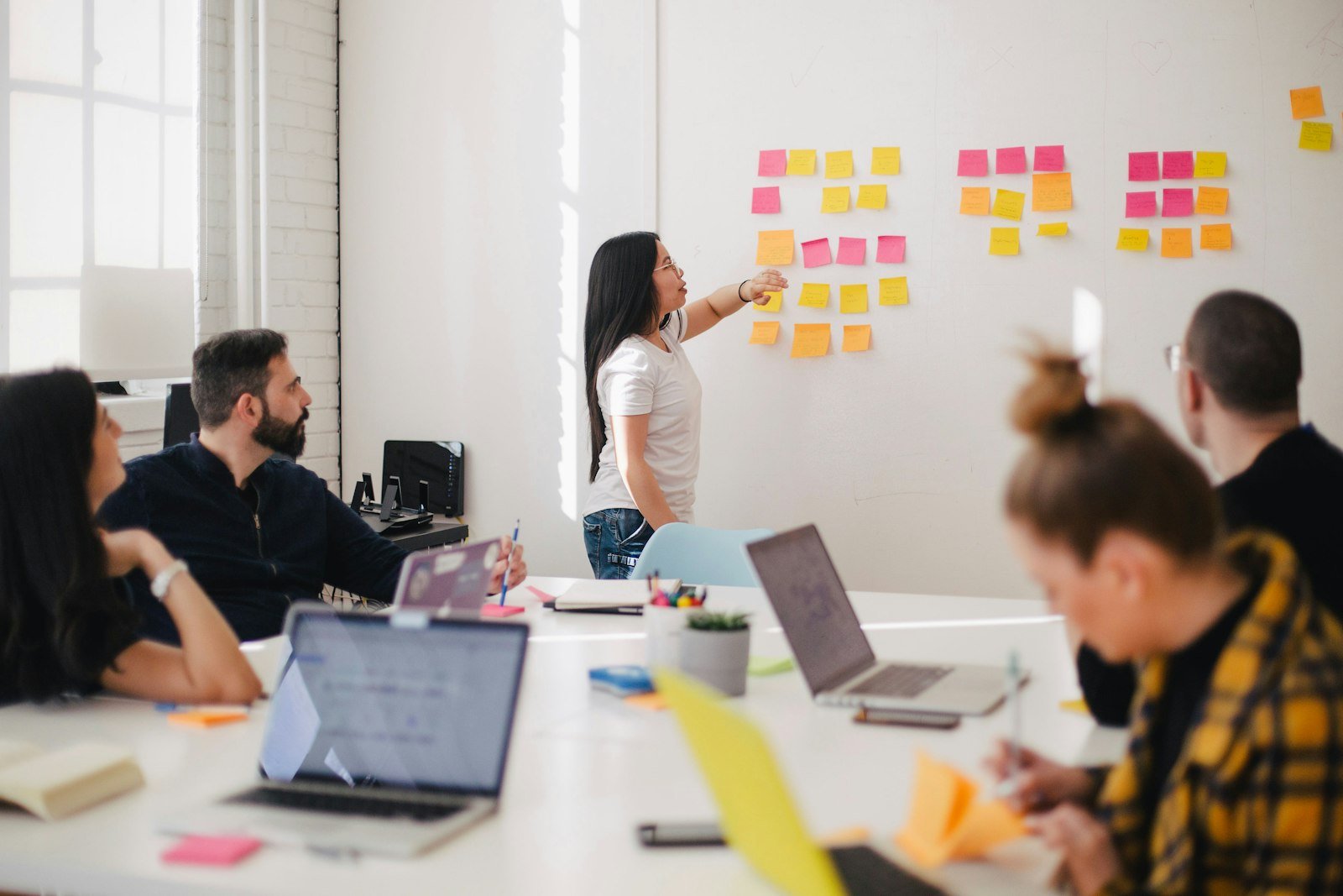 A collaborative product and data team reviewing digital systems
